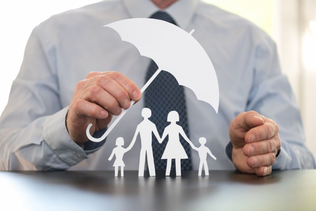 Hand Holding An Umbrella To Protect Family